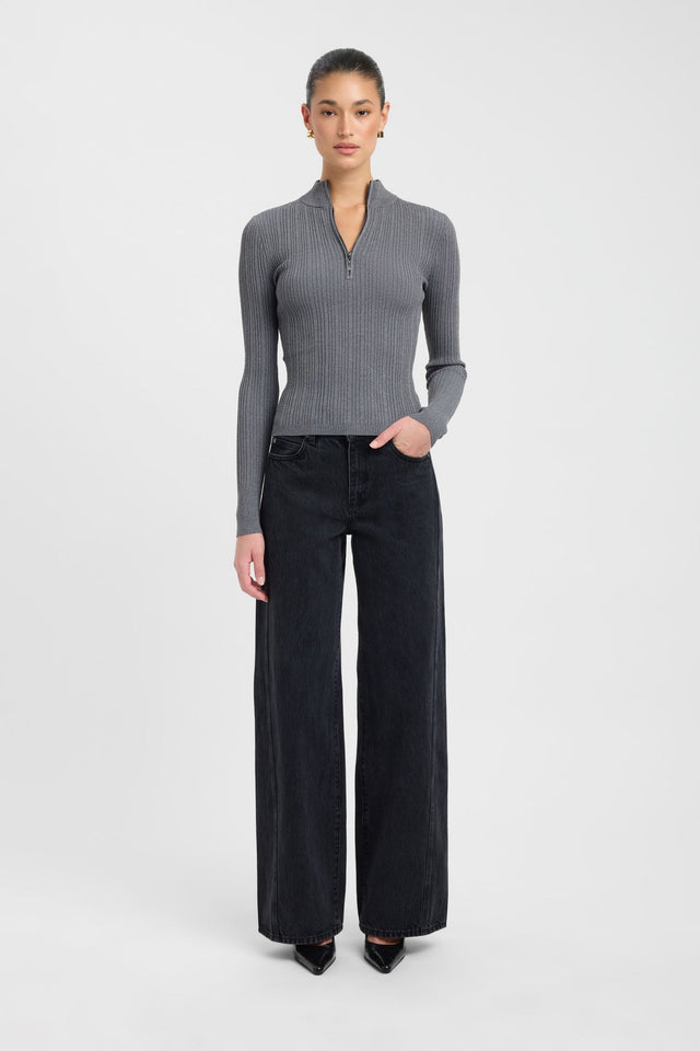 Showcasing the Bristol Zip Top womens blouse in dark grey with fitted silhouette, high-neck design, and full straight sleeves on-body