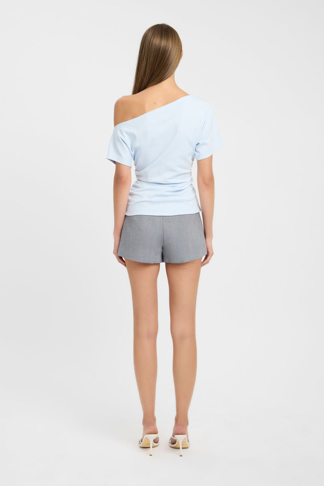 Crafted with the Nova Off Shoulder Tee womens-blouse in powder blue with fitted silhouette, asymmetry neckline and short sleeves back