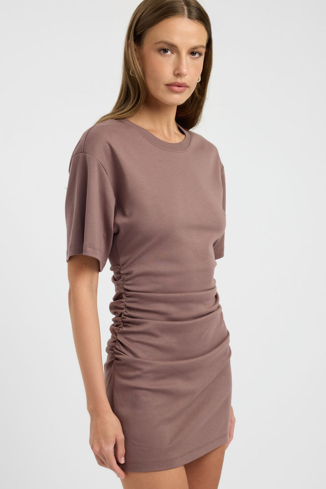 Crafted with a bodycon shape, the Nova Mini Dress in womens dresses features fitted silhouette, round neckline and rosy brown colour side