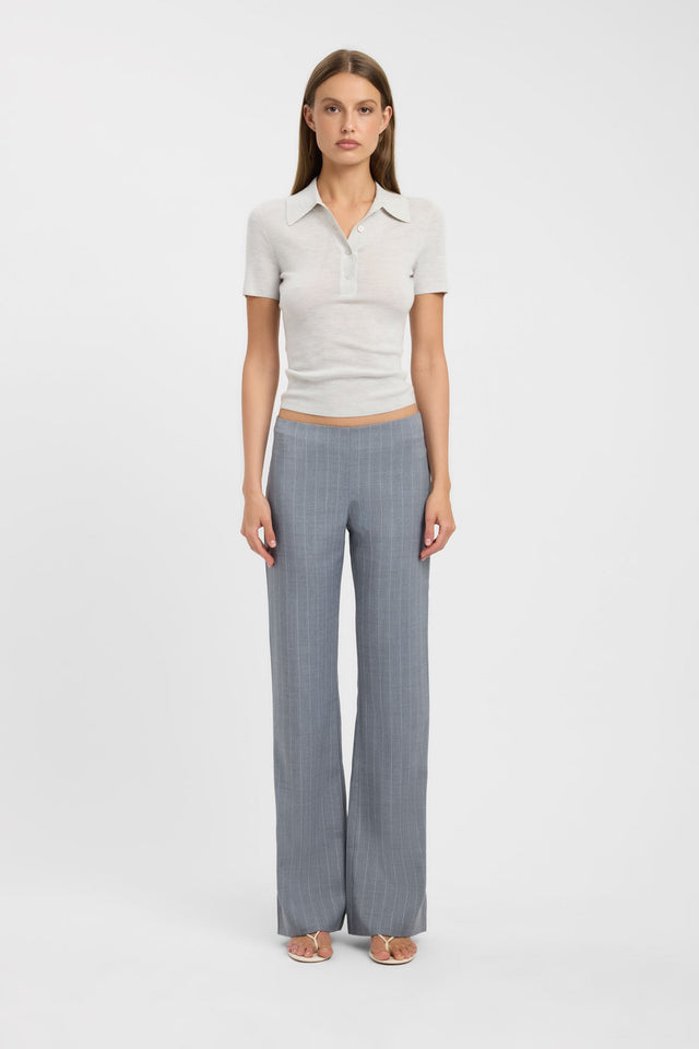 Showcasing the Jackson Polo Top womens blouse in beige with fitted silhouette, v-neck, and short sleeves front