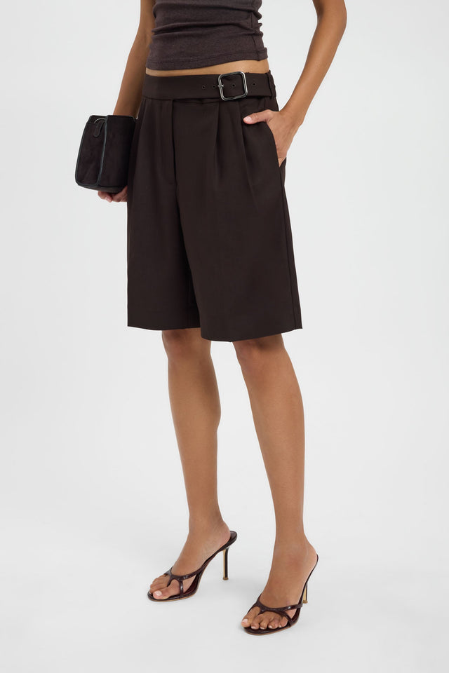 Showcasing the Nola Pleated Long Short in womens-shorts with high-rise relaxed fit in dark khaki detail