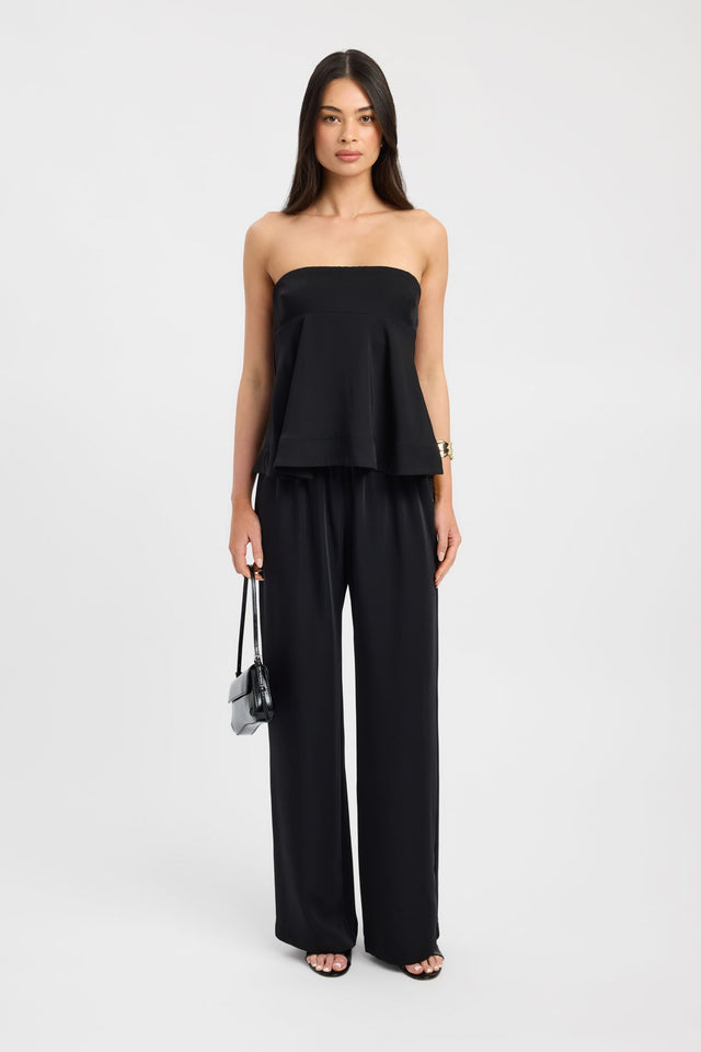 Showcasing the Maria Peplum Top womens-blouse in black with fitted straight neckline sleeveless front