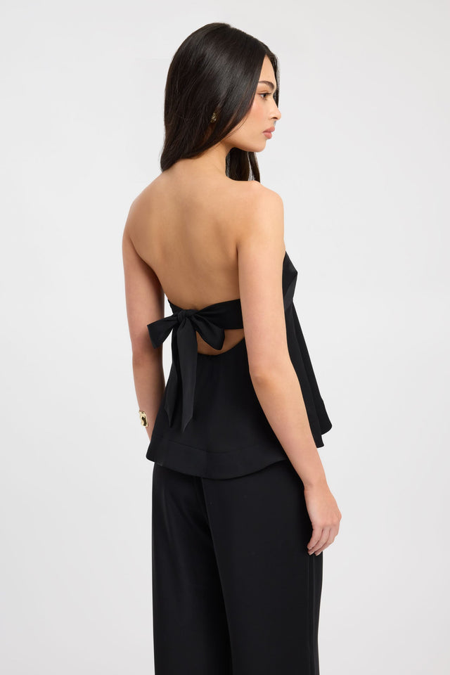 Discover the Maria Peplum Top womens-blouse in black with fitted straight neckline sleeveless back