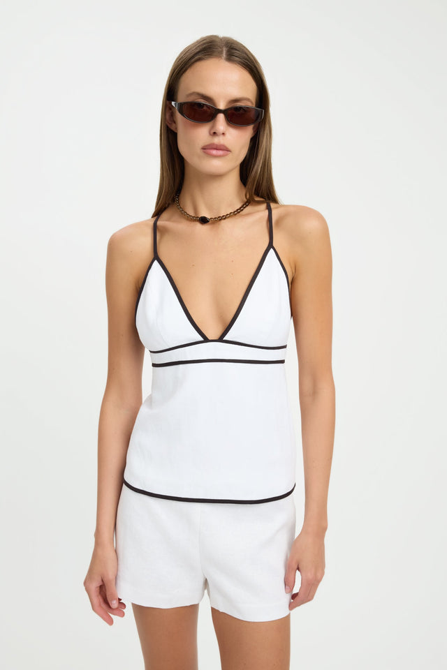 Showcasing the Ios Contrast Piping Top womens blouse in white with black featuring fitted v-neck sleeveless styling front