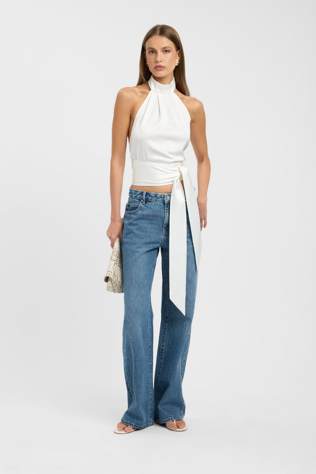 Crafted from ivory fabric the Palermo Wrap Top womens blouse with fitted high-neck sleeveless cut on-body