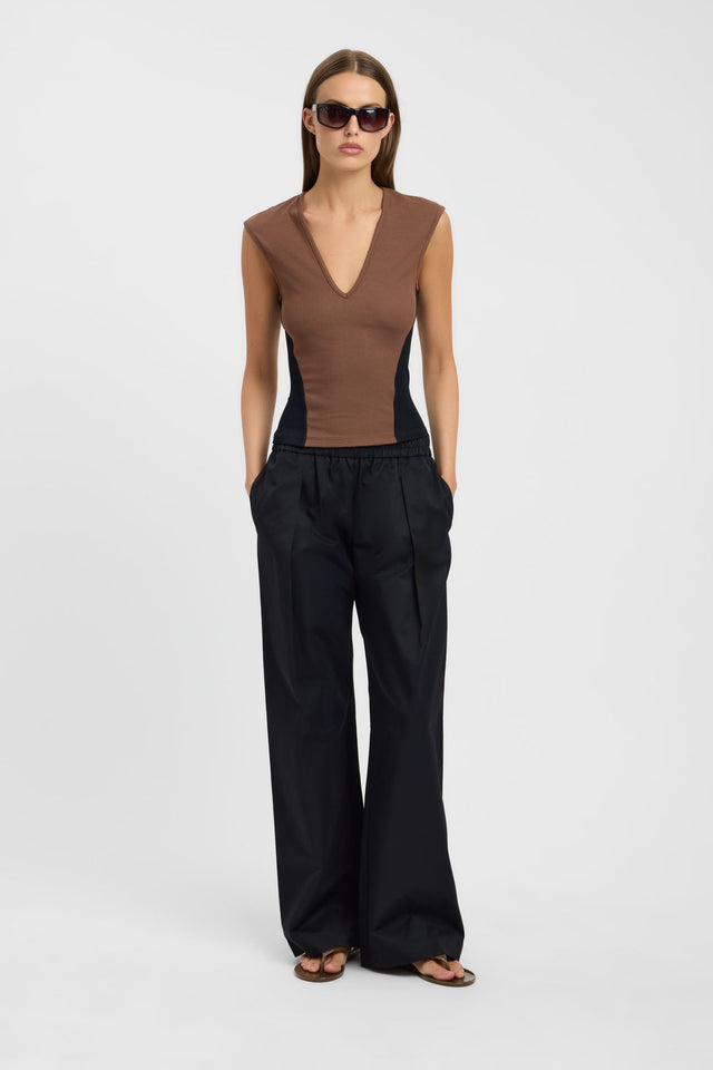 Showcasing the Zuri Contrast Top in womens-blouse with tan and black color-block design, fitted v-neck sleeveless styling front