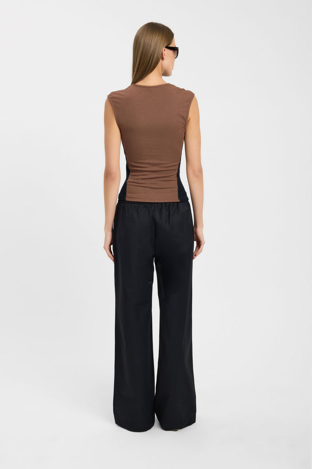 Crafted with color-block design, the Zuri Contrast Top womens-blouse in tan and black featuring fitted v-neck sleeveless styling back