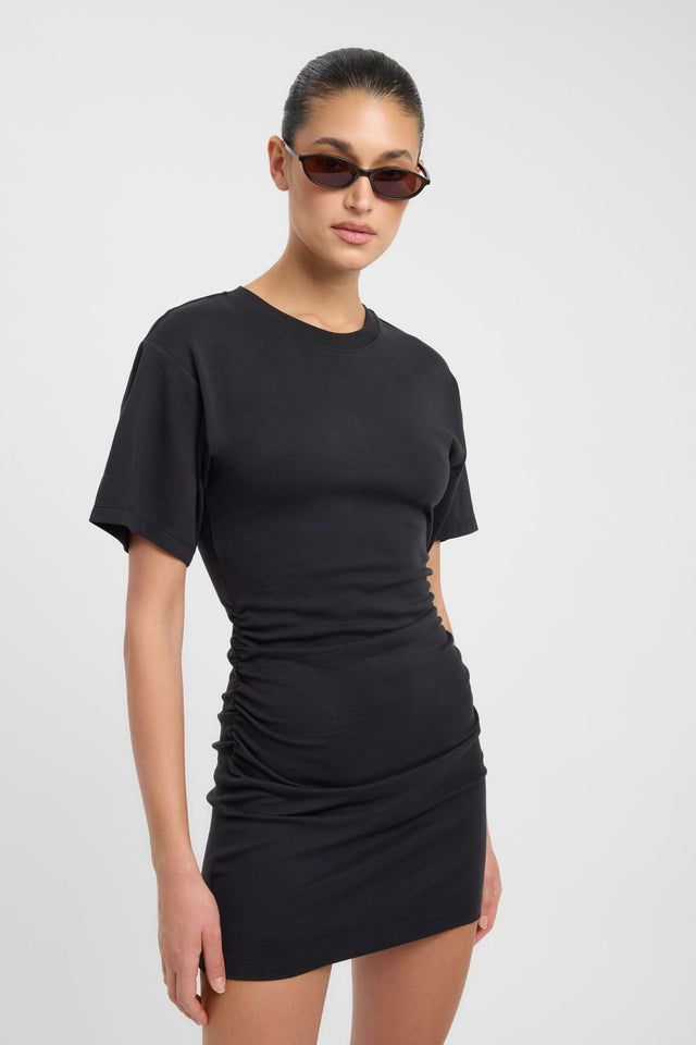 Highlighting the Nova Mini Dress in womens dresses with bodycon shape, mini length, fitted silhouette, round neckline and black color side