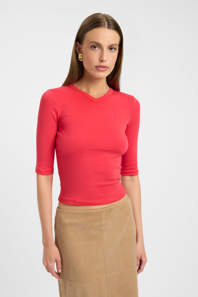 Featuring the Jac Vee Top womens blouse in coral with fitted silhouette, v-neck, and half sleeves detail